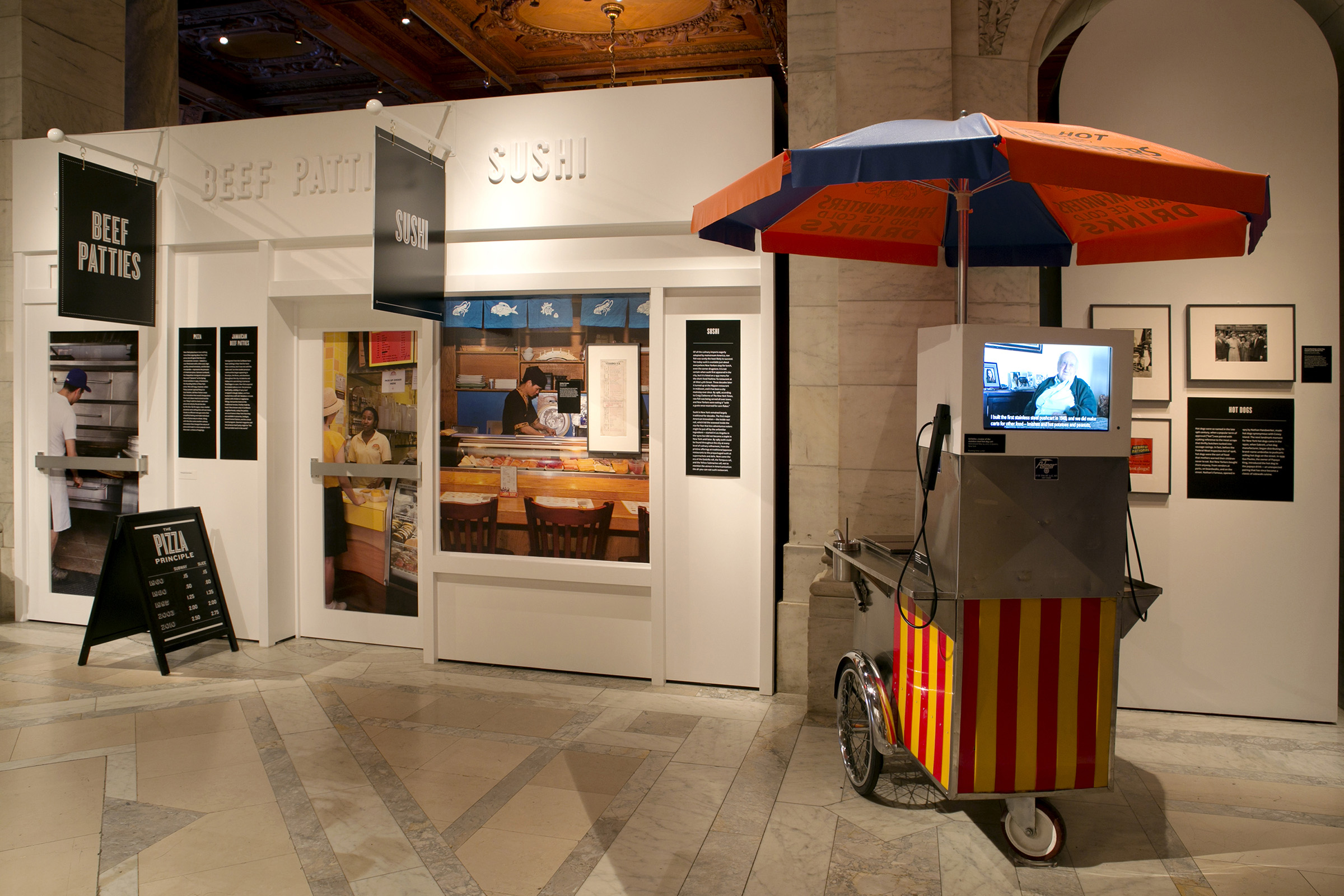 Lunch Hour - In the “Street Food” section, P+A repurposed a hot dog cart to show a video of Ed Bella, the inventor of the ubiquitous stainless-steel push cart.