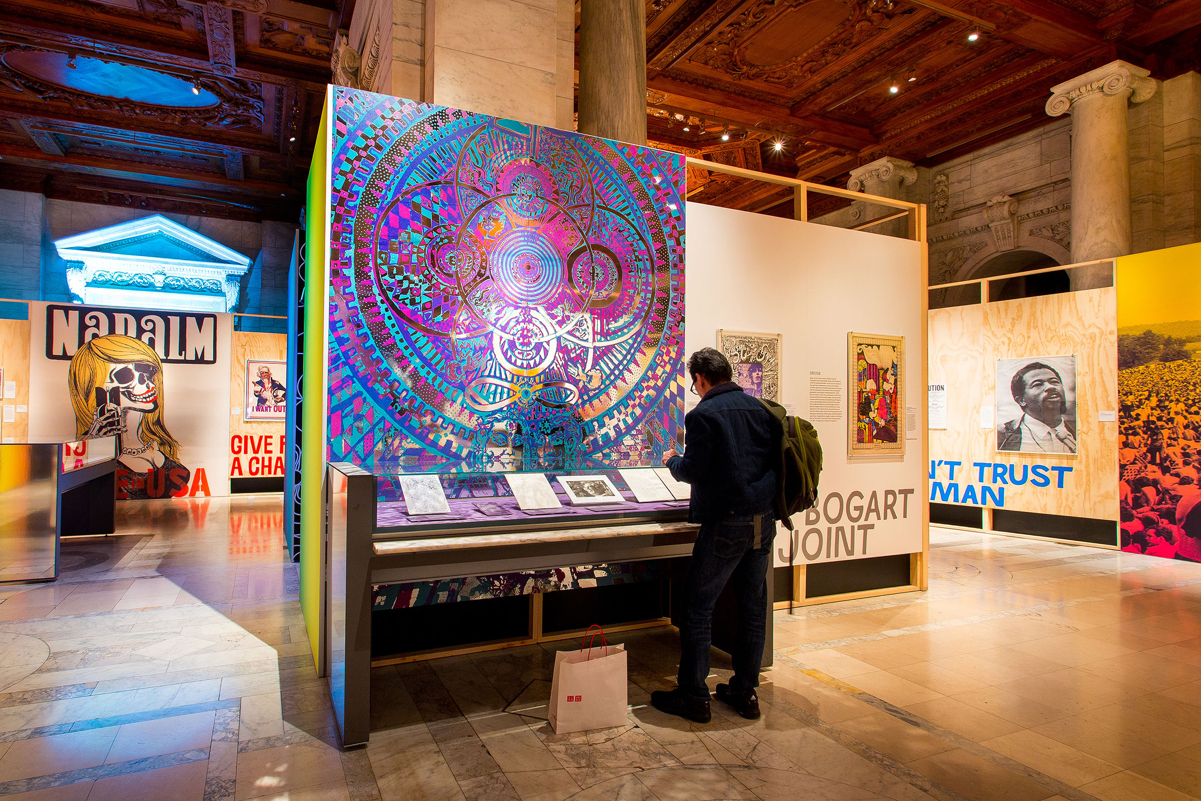 You Say You Want A Revolution - P+A used mirrored vinyl laid atop with graphics throughout the exhibit to convey psychedelia and the kaleidoscopic nature of the counterculture.